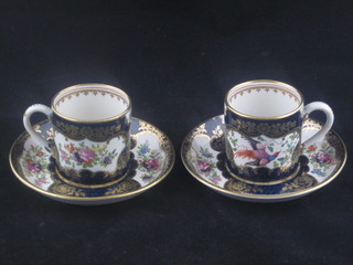 A pair of 19th Century porcelain cabinet cups with deep blue  ground, decorated birds in branches