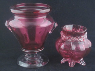 A Victorian cranberry glass globular shaped vase 4" some chips, together with a circular cranberry glass twin handled vase of  campanular form raised on a clear glass spreading foot 6 1/2"