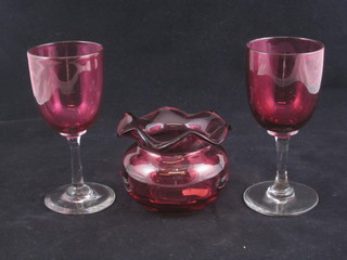6 cranberry glass wine glasses with clear glass stems and a  cranberry glass vase