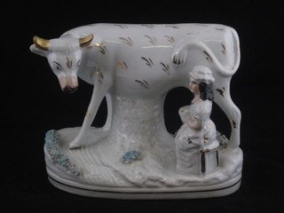 A 19th Century Staffordshire figure group of a standing cow with  milkmaid 6", horns f and r,  ILLUSTRATED