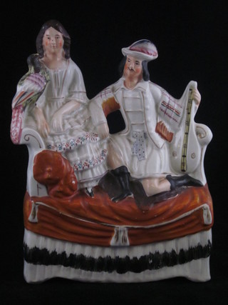 A Staffordshire figure group of a kneeling Scotsman and lady  with parrot 10"  ILLUSTRATED
