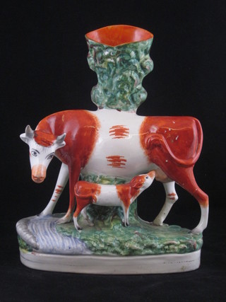 A 19th Century Staffordshire spill vase decorated a standing cow and calf 10 1/2"  ILLUSTRATED