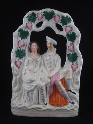 A Staffordshire arbour group of a seated lady and gentleman 13"