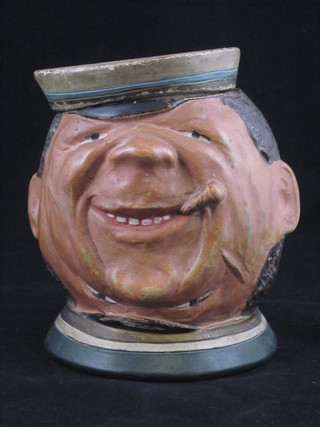 A humerous 19th Century German pottery tobacco jar in the form  of a happy and sad gentleman, 5"
