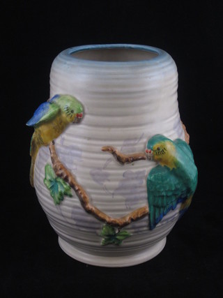 A Clarice Cliff vase decorated budgerigars, the base with Clarice Cliff mark and impressed 2/778 8"