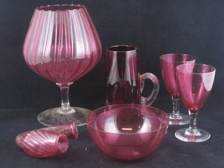 A cranberry glass "pipe" 5", 2 cranberry glass wine glasses with  clear glass stems, do. bowl and 2 other items of red glassware