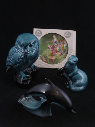 A Poole Pottery blue glazed figure of an owl 6", do. dolphin, sea lion and a Poole Pottery plate