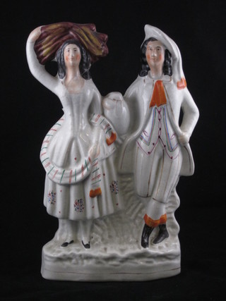 A 19th Century Staffordshire flat back figure of a standing lady  and gentleman, f, 12"