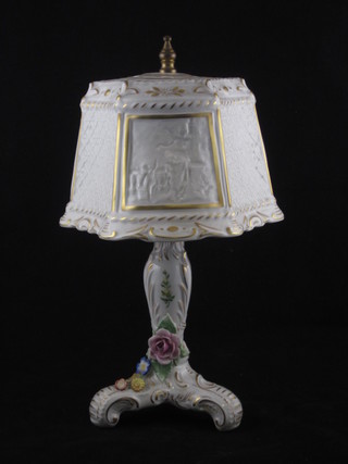 A Continental porcelain table lamp with lithophane shade, raised on a triform base 11"