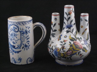 A Delft blue and white mug decorated boats, the base marked KI  5 1/2", together with a Quimper club shaped 3 spouted vase 6"