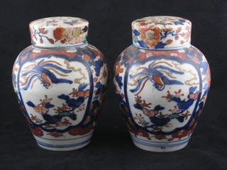 A pair of Imari style porcelain ginger jars and covers 7"