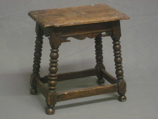 An oak joyned stool, raised on ring turned and block supports  17"