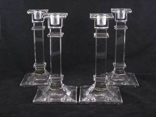 A set of 4 Art Deco square glass candlesticks 8"