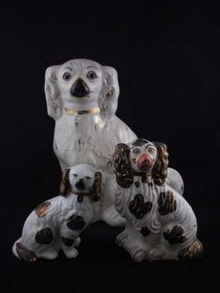 A Staffordshire figure of a standing Spaniel 12" and 2 others 7"  and 6"