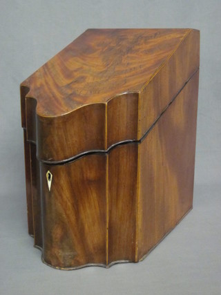 A Georgian mahogany knife box of serpentine outline and hinged  lid, 9", no interior,  ILLUSTRATED