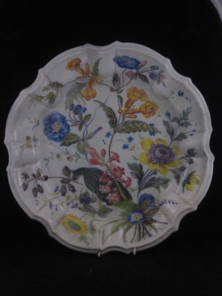An 18th/19th Century circular faience dish with floral decoration, the reverse marked Nove 15", heavily cracked,