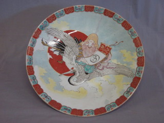 An Oriental circular porcelain charger decorated a figure on a stork 18"