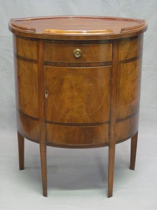A Georgian style mahogany bow front cabinet with galleried top  and inlaid satinwood stringing, the base fitted a drawer above a  cupboard and raised on square tapering supports, 26"