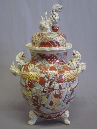 A large late 19th Century Satsuma twin handled urn and cover, the lid decorated a Dog of Fo, 21"