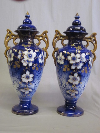 A pair of Victorian blue glazed pottery twin handled urns and  covers 20", 1 lid f and r,