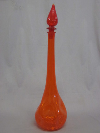 A club shaped orange glass decanter and stopper 15"