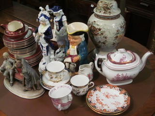 A lustre ware teapot, a pottery Toby jug, a pair of porcelain  figures, a Capo di Monte style figure, an Empire tea service etc