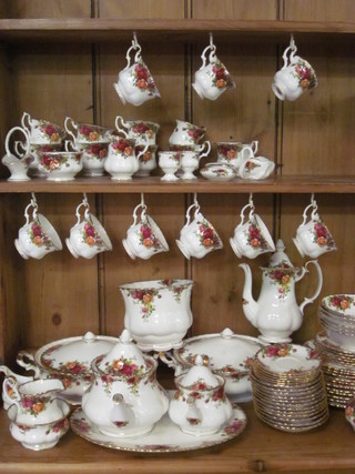 A 78 piece Royal Albert Old Country Rose pattern dinner/tea  service comprising 2 9" circular tureens and covers - 1 second, 6  10" dinner plates - all seconds, 5 8" tea plates - all seconds 1  cracked, 6 6" side plates, 6 6" pudding bowls - all seconds, pair  of egg cups, 13" oval platter - second, large teapot - second,  small teapot, milk jug and sugar bowl - both seconds and sugar  bowl cracked, 12 cups and 12 saucers - 6 cups seconds, coffee  pot, cream jug and sugar bowl, lidded sucrier, 6 coffee cups and  6 saucers, together with a 7" jardiniere, basket 3", model shoe  4", trinket box and cover 2" and a model swan 3",