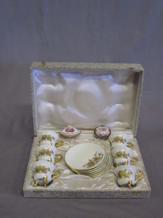 A 12 piece Limoges porcelain coffee service comprising 6 cups  and 6 saucers together with 2 small trinket boxes