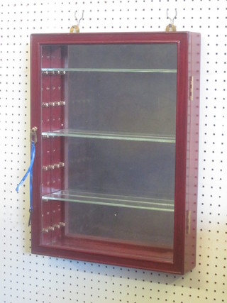 A pair of Oriental hardwood hanging display cabinets, with  shelved interiors and mirrored backs enclosed by glazed doors  15"