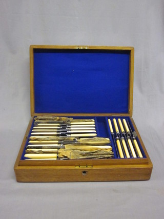 A canteen of steel bladed knives by Joseph Rodgers & Sons contained in an oak canteen box