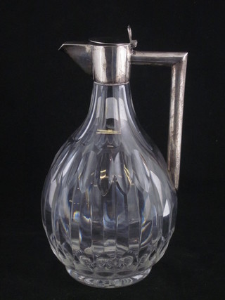 A cut glass and silver mounted claret jug in the manner of Christopher Dresser, London 1897