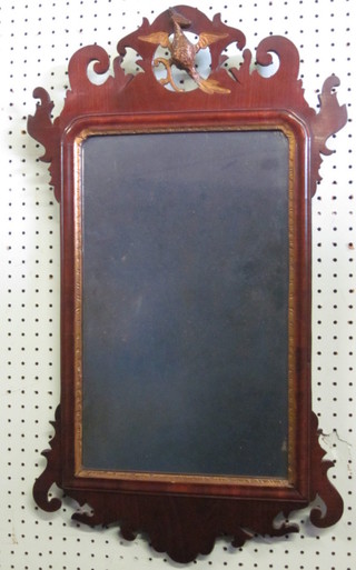 A 18th/19th Century Chippendale rectangular plate mirror,  contained in a mahogany frame and surmounted by a figure of a  bird, 12"