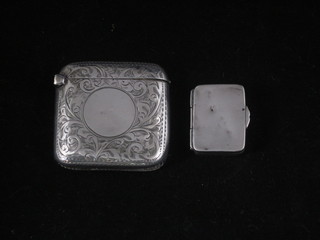 An Edwardian silver pill box with hinged lid Birmingham 1908  1", together with an embossed silver vesta case 1908