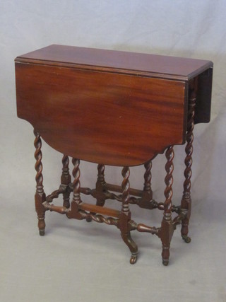 A Victorian mahogany Sutherland table, raised on spiral turned supports 24"