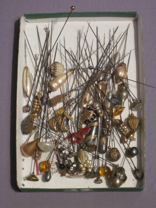 A collection of various hat pins