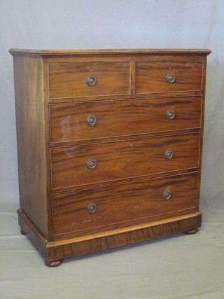 An Edwardian mahogany chest of 2 short and 3 long drawers,  raised on a platform base 35"
