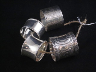 3 silver napkin rings and 1 other