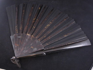 A Victorian fan with "tortoiseshell" sticks, cased, marked Duvellergy
