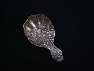 A Georgian embossed silver caddy spoon with floral decoration  and gilt bowl, Birmingham, marks rubbed, makers mark JW