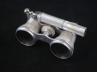 A pair of polished white metal and mother of pearl mounted  opera glasses, terminal end missing,