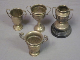 4 silver twin handled trophy cups, 8 ozs