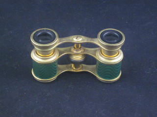 A pair of French gilt metal and enamel opera glasses marked  Jumelle Carpentier contained in a leather carrying case, retailed  by Finnigans