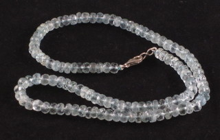 A string of aquamarine coloured beads
