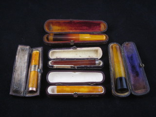 5 various cheroot holders contained in boxes