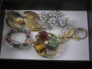 A collection of decorative brooches