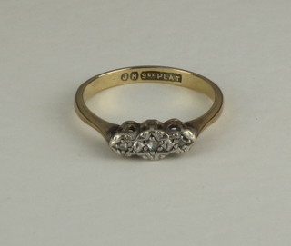 A 9ct gold dress ring set illusion set diamonds