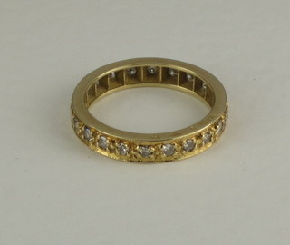 An 18ct yellow gold full eternity ring
