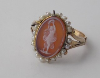 A 19th Century gold dress ring set an oval cut cameo surrounded  by demi-pearls