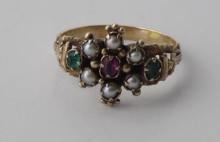 A gold dress ring set pearls, green stones and red stones