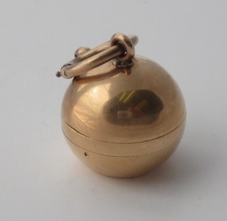 A lady's gold ball charm watch